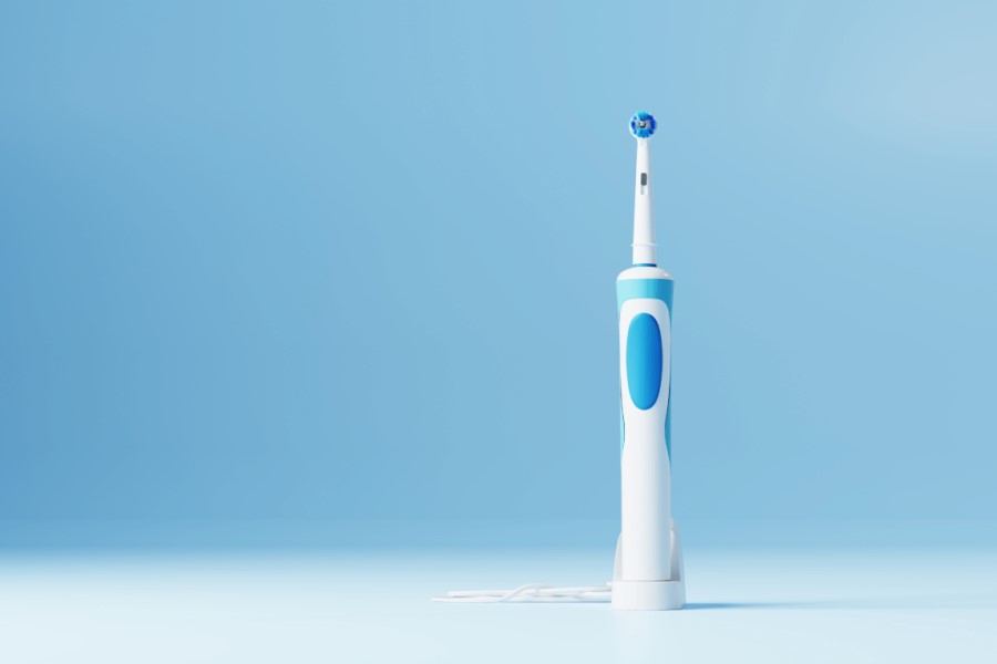 An electric toothbrush posing with far more confidence than necessary